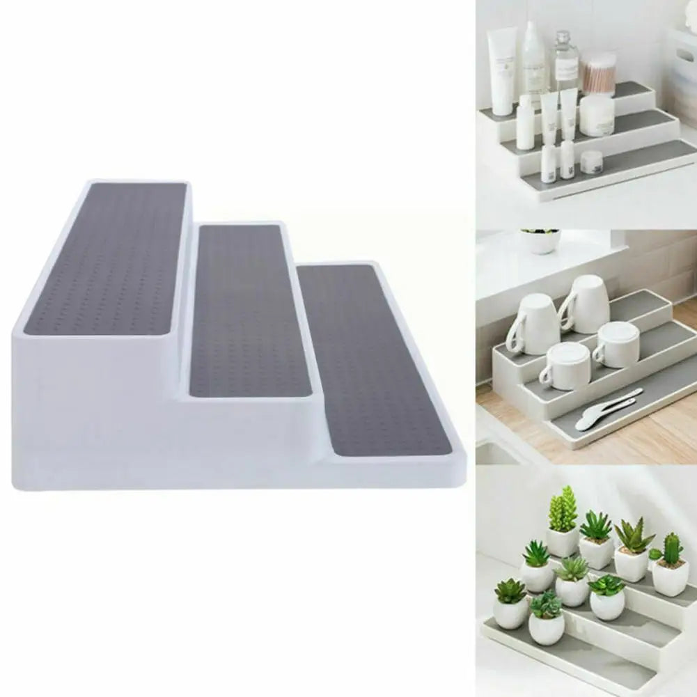 Expandable stepped pantry shelf riser displaying jars and cans